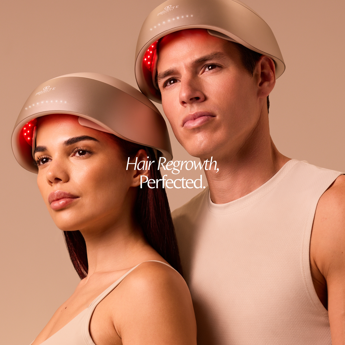 Man and woman wearing LumaLase laser red light hair regrowth helmets